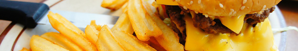 Eating Burger at W & M Bar B-Q Burger restaurant in Honolulu, HI.